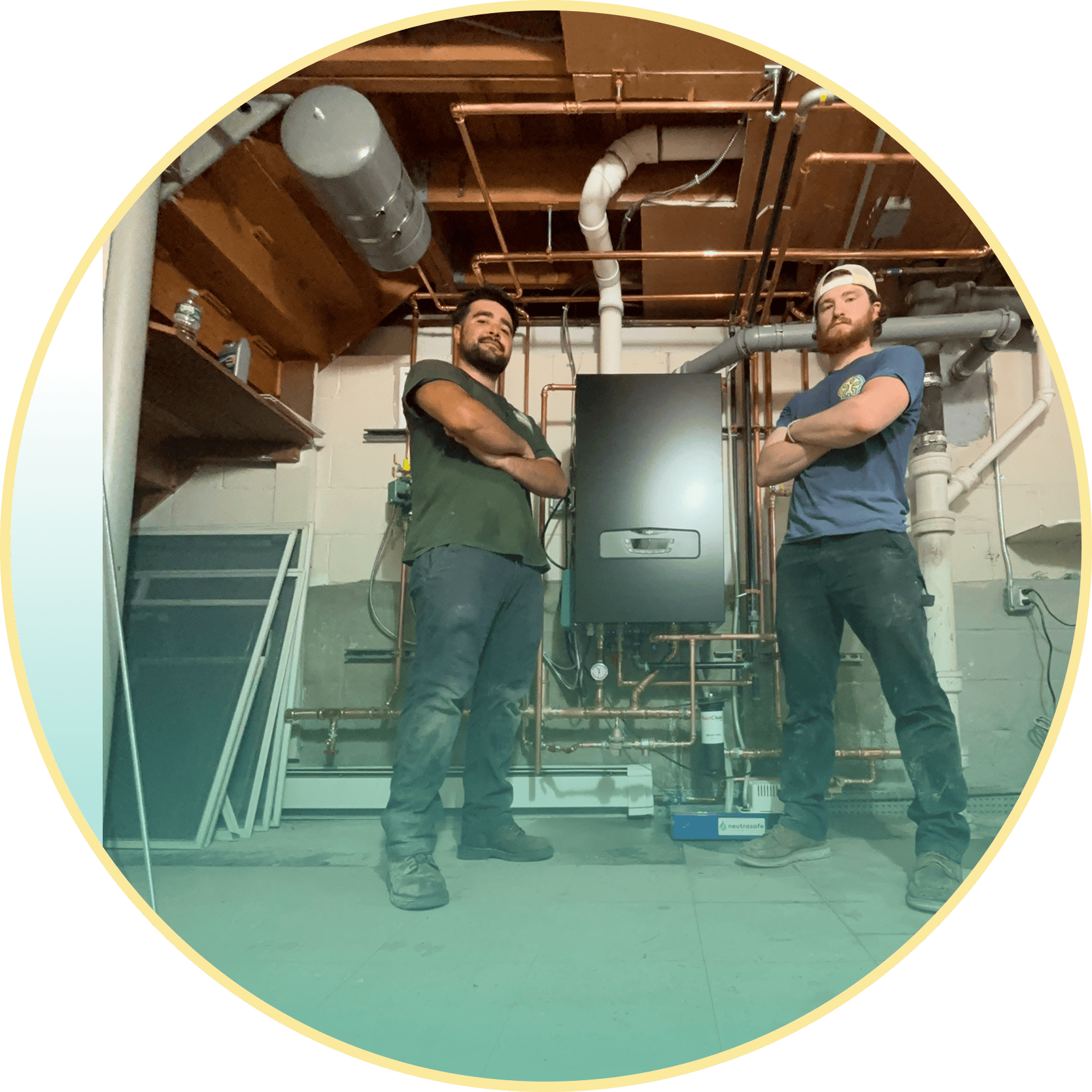 Sustainable Heating & Cooling installation crew proud of their work after installing a boiler.